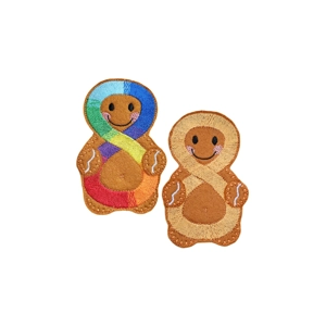Two handmade felt gingerbread characters, each featuring an embroidered infinity symbol on the front — one in rainbow colours and one in gold, representing neurodiversity and autism awareness.