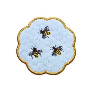 Embroidered Honey Bee candle coaster with honeycomb detail and scalloped edge, designed for candles, small jars and country home decor.