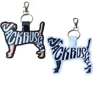 Two Jack Russell word art dog keyrings in black and white faux leather, with embroidered breed designs and metal clasp fittings.