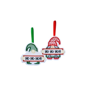 Jolly Ho Ho Ho Christmas Gnome Ornament made from soft felt, featuring two embroidered gnomes holding ‘Ho Ho Ho!!!’ signs — one with a red hat and one with a green hat, each hanging from a matching ribbon.