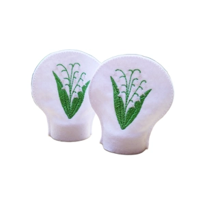 Set of two embroidered Lily of the Valley tealight covers in white with green floral motifs, designed to slip over tealight holders for a decorative finish.