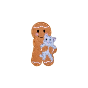 A felt gingerbread character holding a small embroidered pet cat, with stitched facial details and a gentle smiling expression.