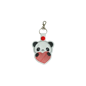 A kawaii-style panda keyring made from faux leather, featuring a smiling panda holding a stitched heart, finished with a metal keyring and lobster clasp.