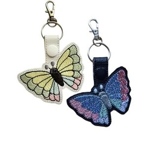 Black and white Pretty Wings Butterfly keyrings with colourful embroidered wing sections, faux leather straps and metal lobster clasps.