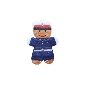 Felt gingerbread Royal Marine character with stitched facial details, wearing a navy uniform with embroidered buttons and belt, and a matching cap with red band and badge.
