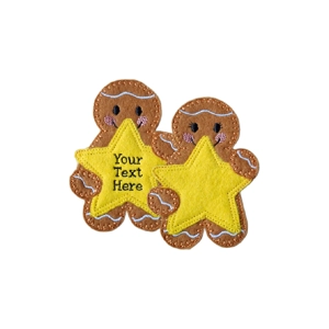 Two gingerbread characters holding yellow star shapes, one with stitched personalised text and one blank star, showing male and female style options.