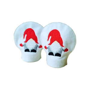 A pair of soft felt tealight covers embroidered with red-hatted gnomes, designed to sit over LED tealights and gently diffuse the light.