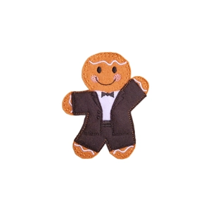 A gingerbread gentleman character wearing a black tuxedo with a white shirt and bow tie, smiling with rosy cheeks.