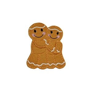 A gingerbread couple in love standing close together with smiling faces, stitched details, and arms gently wrapped around each other in a loving pose.