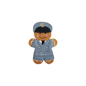 A felt gingerbread RAF officer character wearing a detailed uniform and peaked cap, with a stitched smile, rosy cheeks, and outstretched arms.