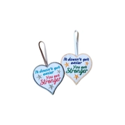 Two handmade felt heart decorations with ribbon hangers, each embroidered with the quote 'It doesn't get easier, you get stronger'. One heart has grey stars with a grey border and ribbon, and the other has gold stars with a gold border and ribbon.