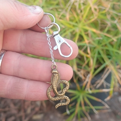 Cobra keychain, bronze color, metal