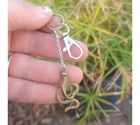 Cobra keychain, bronze color, metal