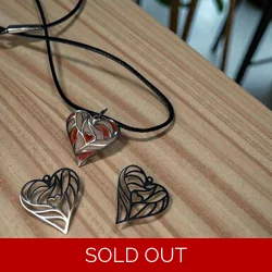 GREY SILVER SECTIONED HEART PENDANT