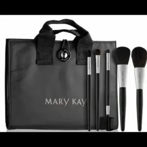 Mary Kay® Brush Collection Set displayed with a sleek carrying case, showcasing various makeup brushes for beauty enthusiasts.