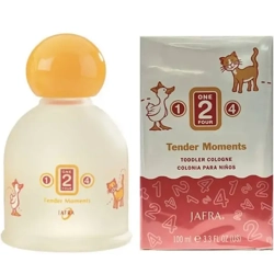The Jafra Tender Moments cologne bottle sitting on a nursery dresser next to a soft teddy bear.