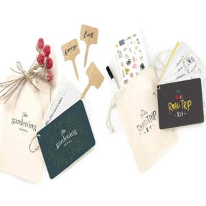 A collection of two Inklings curated kits: the Gardening Planner Journal set and the Kids Road Trip Kit in its canvas bag