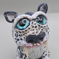 Sabertooth Snow Leopard