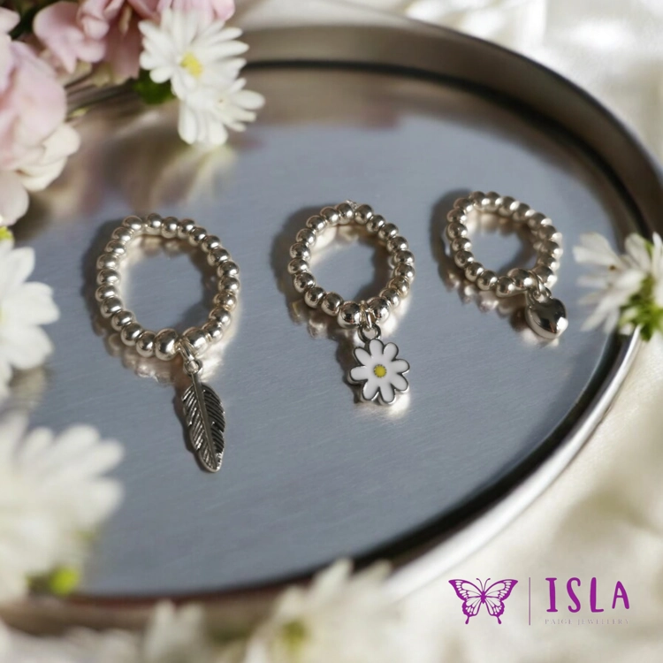 Silver beaded ring with charm