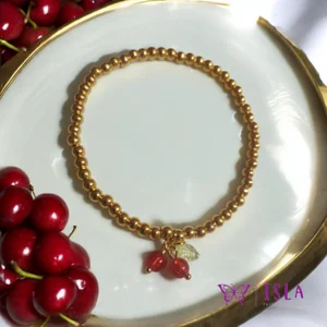 Gold cherry beaded brac..