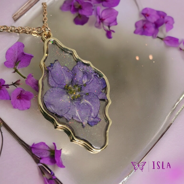 Gold and purple resin flower..