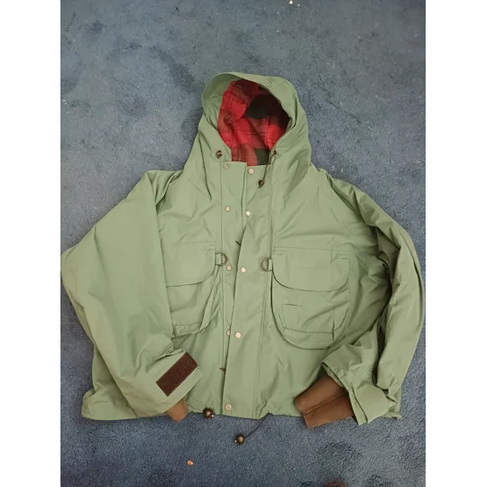 NomadUK Sportsman Ventflex breathable blue-green fishing jacket with peaked hood and D-ring breast pockets