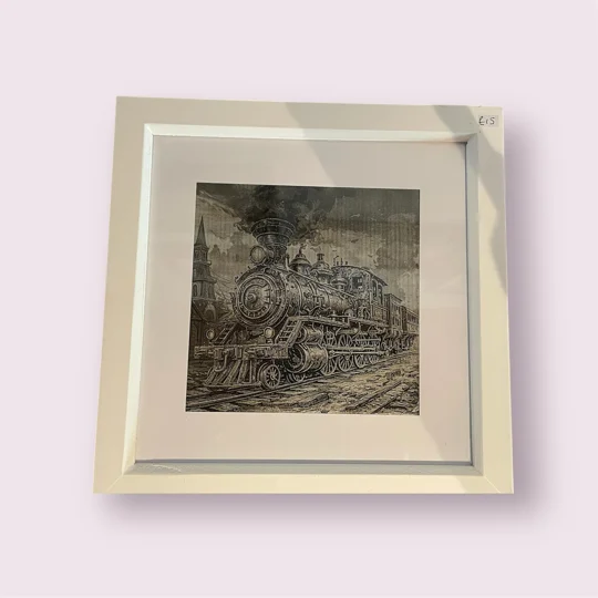 ceramic tile, engraved with a classic steam train, in a white frame, made in Scarborough,uk