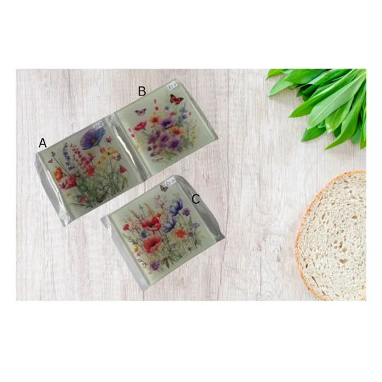 The coaster features a captivating image of vibrant spring flowers, beautifully complemented by a delicate butterfly, creating a serene and refreshing ambiance in any room.
