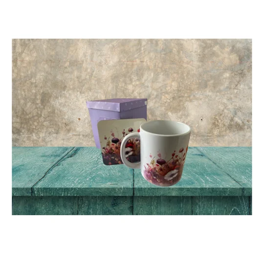 This beautifully designed 11oz Ceramic Mug is the perfect addition to any coffee or tea lover's collection. The mug features a charming floral design that adds a touch of elegance to your morning routine. The matching cork backed MDF coaster not only protects your table from heat and moisture but also complements the overall aesthetic of the set.