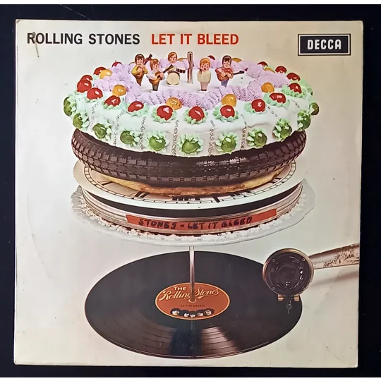This is an original UK stereo pressing of Let It Bleed by The Rolling Stones, issued on Decca SKL 5025 with the boxed Decca logo. This particular version is known for a rare label misprint, where the matrix text appears upside-down on the label—a sought-after detail for collectors.