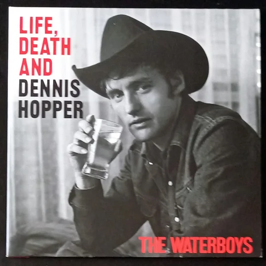 Life, Death & Dennis Hopper is Mike Scott’s ambitious 25-song concept album that traces the life, myth and music of Dennis Hopper. Spanning cinematic folk, blues and rock vignettes, the record features a rollcall of guest artists (including Steve Earle, Bruce Springsteen, Fiona Apple and Taylor Goldsmith) and moves between short, punchy narratives and widescreen arrangements.