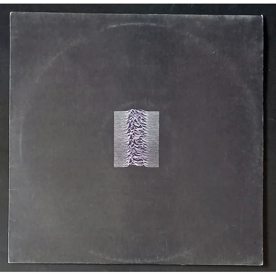 Unknown Pleasures is one of the most important debut albums in modern music history. Released in 1979, it introduced Joy Division’s stark, haunting sound to the world, pairing Ian Curtis’s deeply emotive vocals with Martin Hannett’s groundbreaking, atmospheric production.