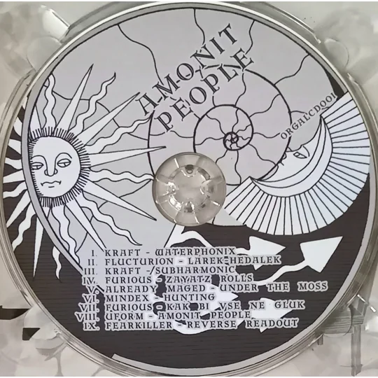 VA – Amonit People CD is a Russian psy-trance compilation released on Organic Alchemy Records, showcasing a deep and atmospheric selection of underground producers. The release leans into organic psychedelic structures, blending rolling basslines with intricate sound design and a strong forest-influenced aesthetic.