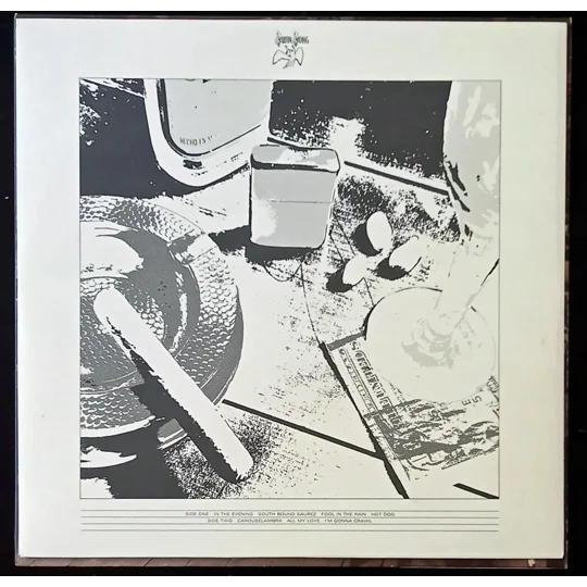 Led Zeppelin – In Through The Out Door (Alternative Cover Edition) is one of the band’s most creatively packaged albums and a true collector’s piece. Originally released in 1979, this version includes a brown paper bag outer sleeve with the band name and title stamped on the front, designed to resemble a bootleg.