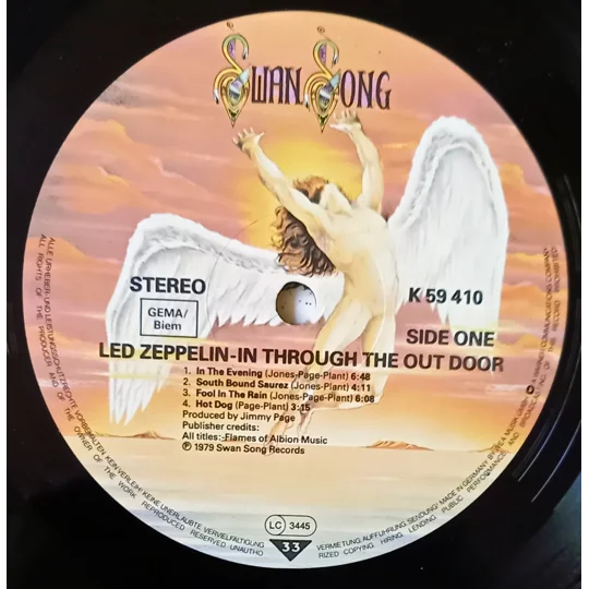 Led Zeppelin – In Through The Out Door (Alternative Cover Edition) is one of the band’s most creatively packaged albums and a true collector’s piece. Originally released in 1979, this version includes a brown paper bag outer sleeve with the band name and title stamped on the front, designed to resemble a bootleg.
