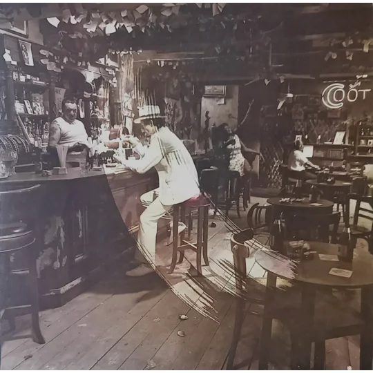 Led Zeppelin – In Through The Out Door (Alternative Cover Edition) is one of the band’s most creatively packaged albums and a true collector’s piece. Originally released in 1979, this version includes a brown paper bag outer sleeve with the band name and title stamped on the front, designed to resemble a bootleg.