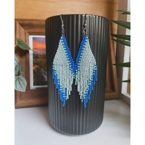 A pair of handmade beaded fringe earrings. Colors in a gradient Blue, Light Blue, Sparkle Blue