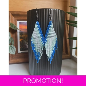 A pair of handmade beaded fringe earrings. Colors in a gradient Blue, Light Blue, Sparkle Blue