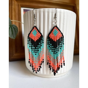 Designed to evoke a sense of movement and vivacity
Black, Coral, and Aqua