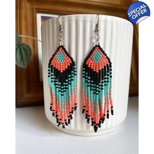 Designed to evoke a sense of movement and vivacity
Black, Coral, and Aqua