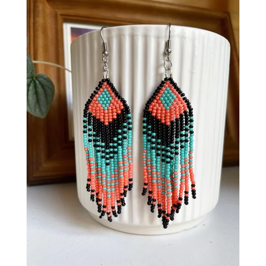 Designed to evoke a sense of movement and vivacity
Black, Coral, and Aqua