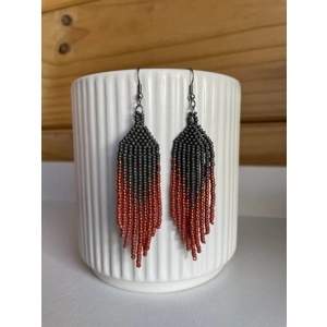 Handmade beaded Earrings

Where colours cascade in a breathtaking display of vibrancy and elegance. Each bead is carefully selected to create a mesmerising gradient effect, reminiscent of a cascading waterfall of hues. 

Black, sparkley red, and red