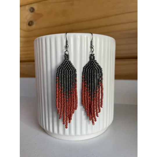 Handmade beaded Earrings

Where colours cascade in a breathtaking display of vibrancy and elegance. Each bead is carefully selected to create a mesmerising gradient effect, reminiscent of a cascading waterfall of hues. 

Black, sparkley red, and red