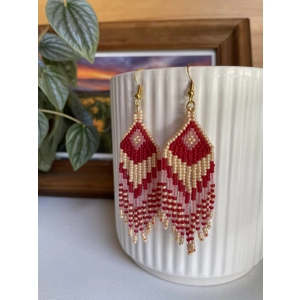 Handmade beaded Earrings

Where colours cascade in a breathtaking display of vibrancy and elegance. Each bead is carefully selected to create a mesmerising gradient effect, reminiscent of a cascading waterfall of hues. 

Red, Gold, Frosted white