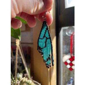 These unique earrings feature intricate beadwork, capturing the delicate charm of butterfly wings in vibrant colors.
Frosted Teal