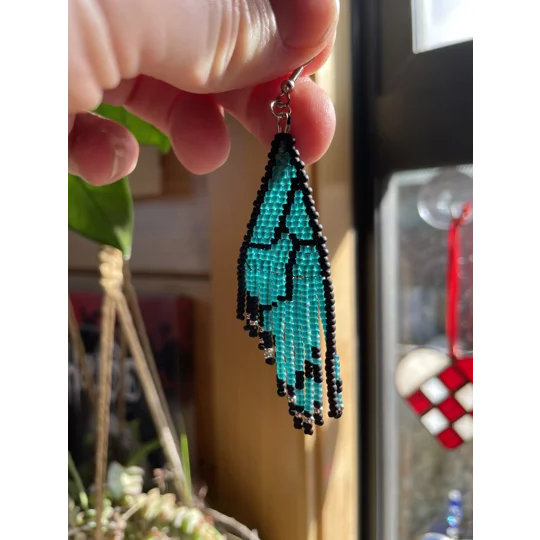 These unique earrings feature intricate beadwork, capturing the delicate charm of butterfly wings in vibrant colors.
Frosted Teal