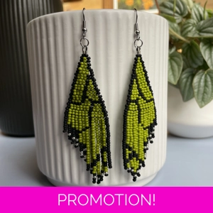 Unique earrings feature intricate beadwork, capturing the delicate charm of butterfly wings in vibrant green