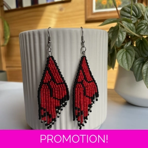 Unique earrings feature intricate beadwork, capturing the delicate charm of butterfly wings in vibrant red