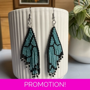 Unique earrings feature intricate beadwork, capturing the delicate charm of butterfly wings in matte teal