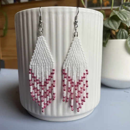 captivating chevron shapes, exuding a sense of dynamic movement and modern flair.  
pink and white beads